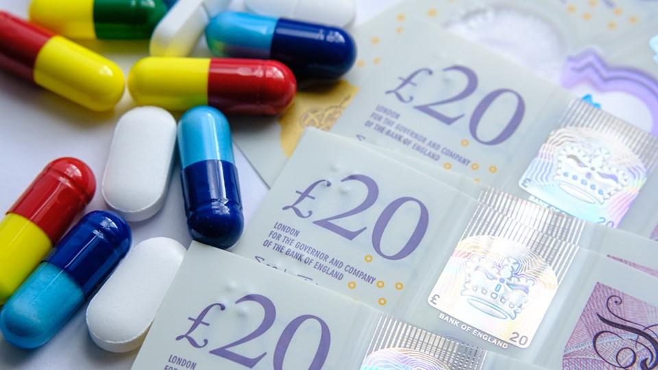 Medicines pricing, UK £20 notes with various pills